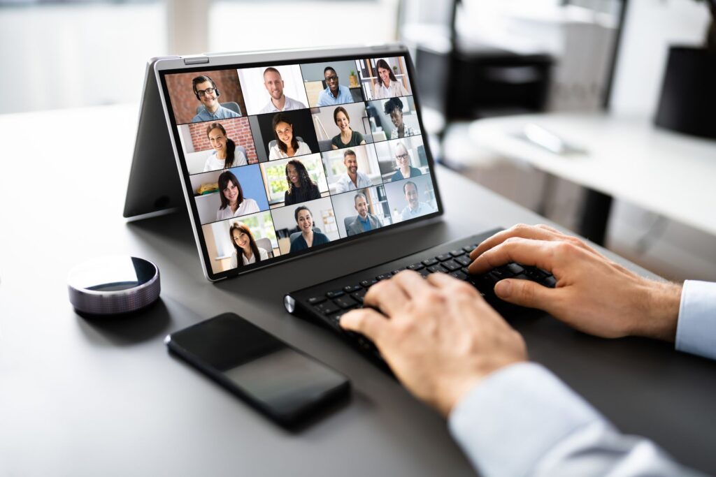 Tablet with a wireless keyboard and smartphone on a desk, representing tools used to secure your hybrid workforce.